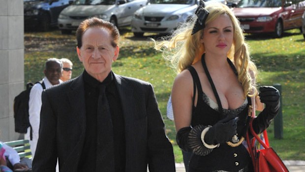 Geoffrey Edelsten and Gabi Grecko at Tom Hafey's funeral. (AAP)