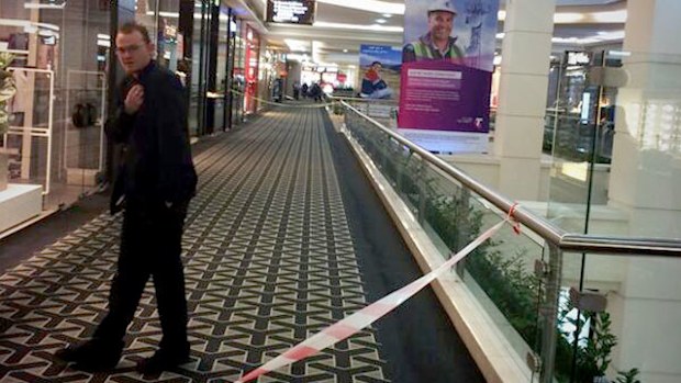 Police guard the scene at Westfield Parramatta where a man was allegedly stabbed to death. (Twitter/Michelle Taverniti)