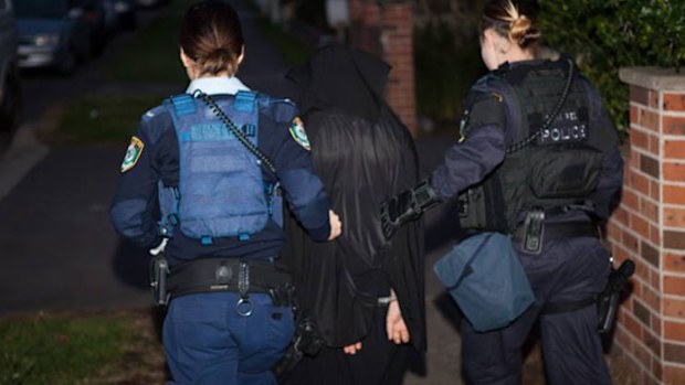 A total of 14 men are arrested in the raids, with one man charged with serious terrorism offences. Police reveal that some people resisted arrest and officers used "reasonable force" to take them into custody.