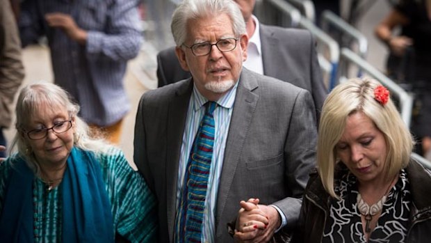 Rolf Harris outside Southwark Court in London in July 2014 alongside wife Alwen (left) and daughter Bindi. (AAP)