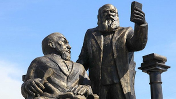 The monument in Kazakhstan has been hastily removed after locals likened the figures on it to hobbits taking a 'selfie'. (Supplied)