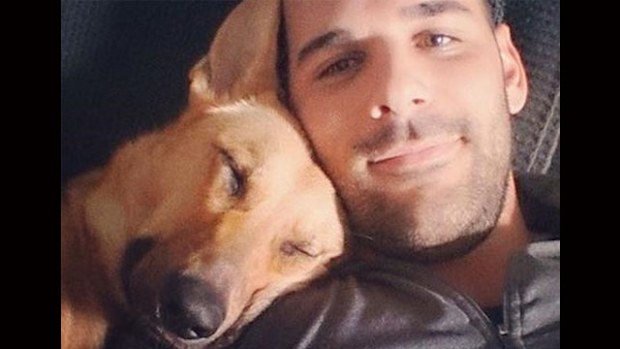 Nathan Cirillo and one of his pet dogs.