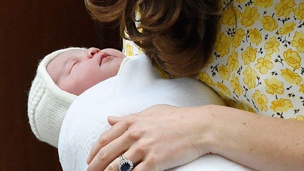 Kate Middleton holds the new royal baby.