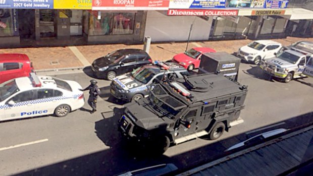 Heavily armed police surround a brothel on George Street in Liverpool. (Supplied)