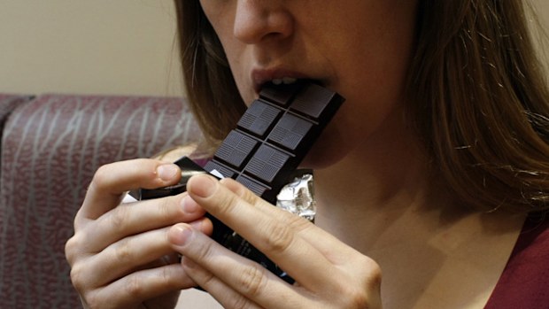Research shows warning women that eating chocolate can make them fat may drive some to eat more.