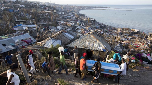 Residents carry a coffin containing the remains of a pregnant woman, a victim of Hurricane Matthew, in Jeremie, Haiti. (AP)