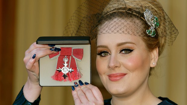 YouTube plans to silence the works of indie musicians like UK songstress Adele, seen here with her MBE award for her services to music (Getty).