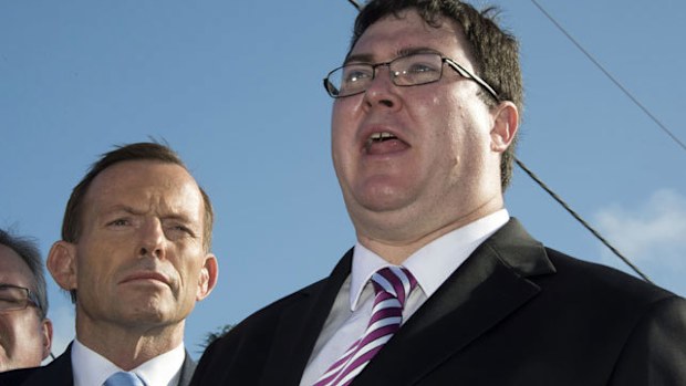 George Christensen (pictured with Prime Minister Tony Abbott) says halal food could be funding Islamic extremism. (AAP)