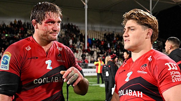 Ethan Blackadder of the Crusaders and James O'Connor of the Crusaders react.