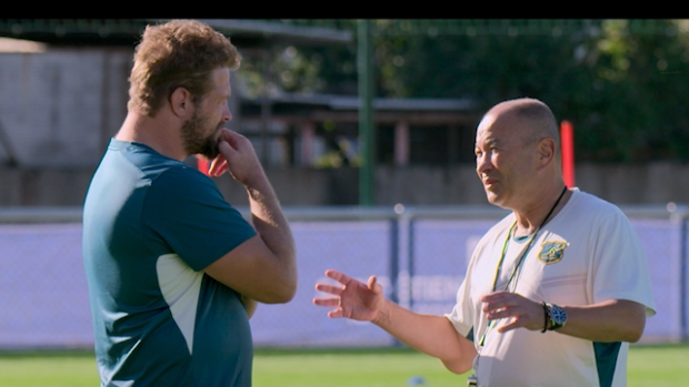 Eddie Jones in conversation with James Slipper in France.