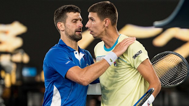 Novak Djokovic (L) of Serbia embraces Alexei Popyrin (R) of Australia after winning match point in his round two singles match during day four of the 2024 Australian Open at Melbourne Park on January 17, 2024 in Melbourne, Australia. (Photo by Andy Cheung/Getty Images)