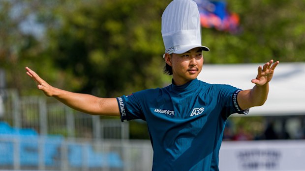 Min Woo Lee celebrates his 2023 Australian PGA Championship win on the 17th green, donning a chef's hat and engaging with the roaring crowd.