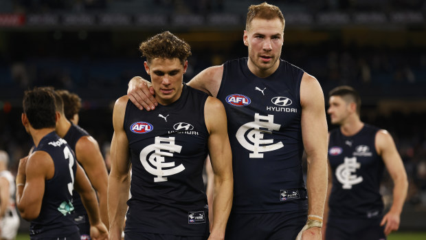 MELBOURNE, AUSTRALIA - AUGUST 21: Harry McKay of the Blues and Charlie Curnow of the Blues look dejected after the round 23 AFL match between the Carlton Blues and the Collingwood Magpies at Melbourne Cricket Ground on August 21, 2022 in Melbourne, Australia. (Photo by Daniel Pockett/Getty Images)