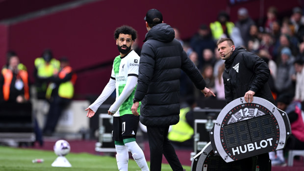 Mohamed Salah of Liverpool argues with Jurgen Klopp, Manager of Liverpool on the touch line ahead of a substitution during the Premier League match between West Ham United and Liverpool FC at London Stadium on April 27, 2024 in London, England. (Photo by Justin Setterfield/Getty Images)