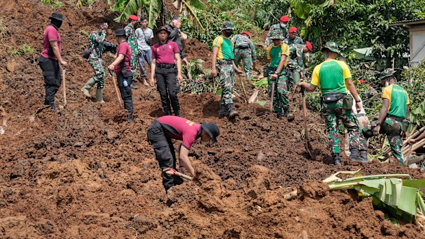 Rescuers search for victims of an earthquake-triggered landslide in Cianjur, West Java, Indonesia, Wednesday, Nov. 23, 2022. 