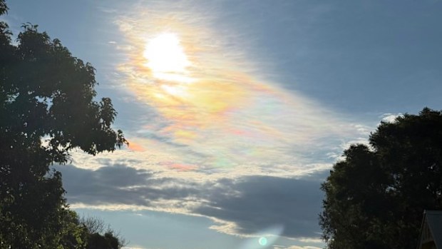 A Sydney photographer has captured a rarely observed rainbow cloud phenomenon called "irridescent clouds."Maria Milford was driving to the Gold Coast when she spotted the iridescent clouds over the sky in Woolgoolga, NSW. 
