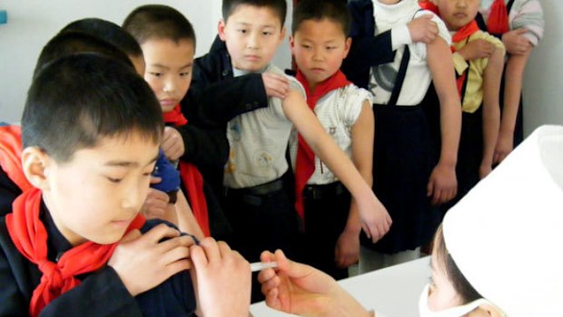 North Korean school children receive a TB vaccine shot. 