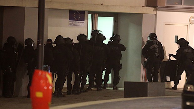 Police are seen during an operation in the 'Croix-Rouge' suburb of Reims, northern France. (Getty)
