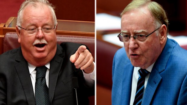 LNP Senators Barry O'Sullivan , left, and Ian Macdonald. (AAP).