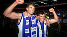 Wayne Carey and Anthony Stevens celebrate victory after the 1996 grand final. (Getty)