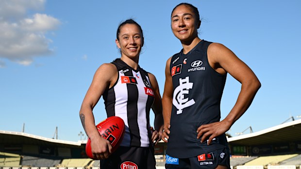 Brittany Bonnici of the Magpies and Darcy Vescio of the Blues pose ahead of the AFLW season 10 opener at Ikon Park.