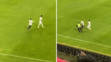A fan attacks a player during a football game in Colombia.