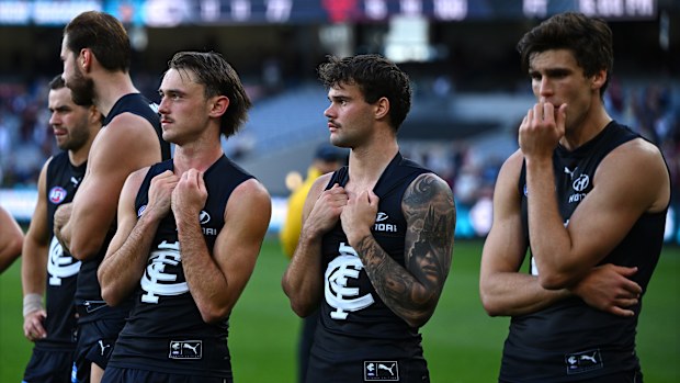 Carlton players after the loss to Melbourne. 