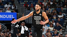 Ben Simmons and Cameron Johnson of the Brooklyn Nets high five.