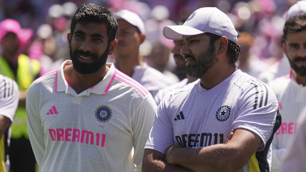 India's Jasprit Bumrah talks with teammate India's captain Rohit Sharma, right, following the fifth cricket test between India and Australia at the Sydney Cricket Ground, in Sydney, Australia, Sunday, Jan. 5, 2025. (AP Photo/Mark Baker)