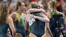 Australia's players embrace after going down in the women's gold medal water polo match against Spain at the Paris 2024 Olympic Games.