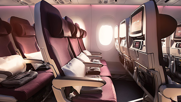 The inside of a Qatar Airways plane.