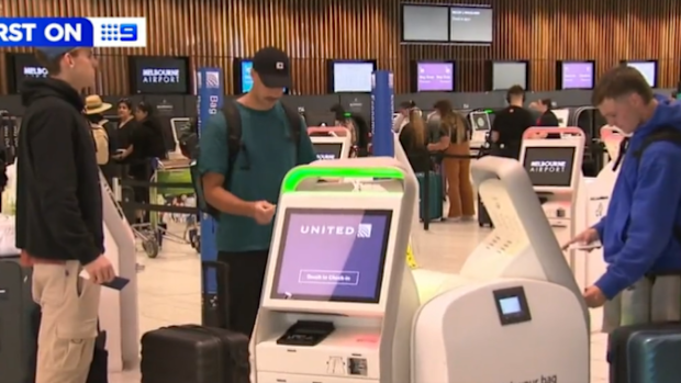 Essendon players at the airport.