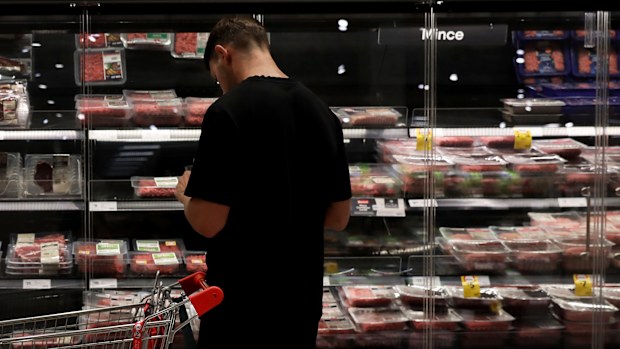  In this photo illustration, shoppers look at meat products on display at a inner-city grocery store on March 25, 2025 in Sydney, Australia. 