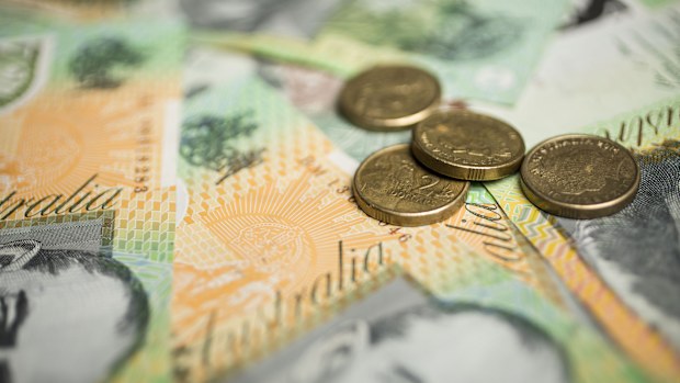 A generic picture of Australian money - $2 coins on top of $100 notes.