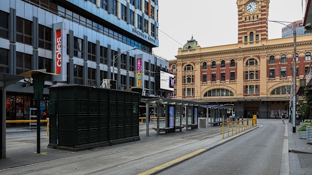 MELBOURNE, AUSTRALIA - SEPTEMBER 18: A deserted Elizabeth Street tram stop near Flinders Street station on September 18, 2021 in Melbourne, Australia. Anti-lockdown protests have been planned in Melbourne despite current COVID-19 restrictions prohibiting large outdoor gatherings. Victoria police are shutting down the public transport network in the CBD in a bid to discourage protestors. Metropolitan Melbourne is currently subject to lockdown restrictions as health authorities work to contain the
