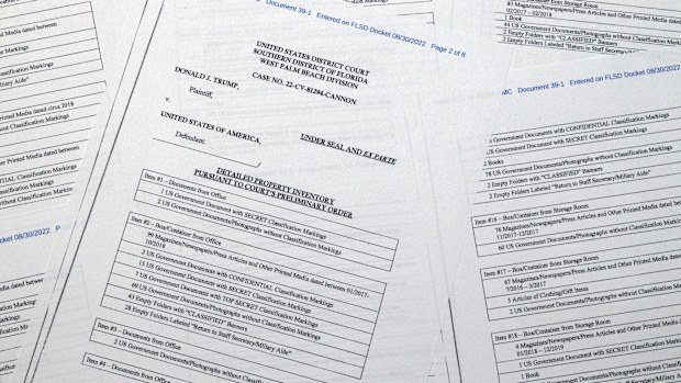 Pages from a FBI property list of items seized from former President Donald Trump's Mar-a-Lago estate and made public by the Department of Justice, are photographed Friday, Sept. 2, 2022. FBI agents who searched the home found empty folders marked with classified banners. The inventory reveals in general terms the contents of the 33 boxes taken during the Aug. 8 search. (AP Photo/Jon Elswick)