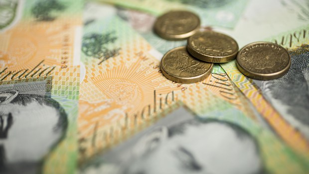 A generic picture of Australian money - $2 coins on top of $100 notes.