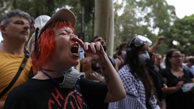 SYDNEY, AUSTRALIA - FEBRUARY 10: A protester chants during a rally against Israeli President Isaac Herzog's Australian visit and police brutality at Harmony Park on on February 10, 2026 in Sydney, Australia. Herzog is on a visit to Australia from Feb 8-12 that will take in official engagements as well as meetings with the Jewish community. (Photo by Lisa Maree Williams/Getty Images)