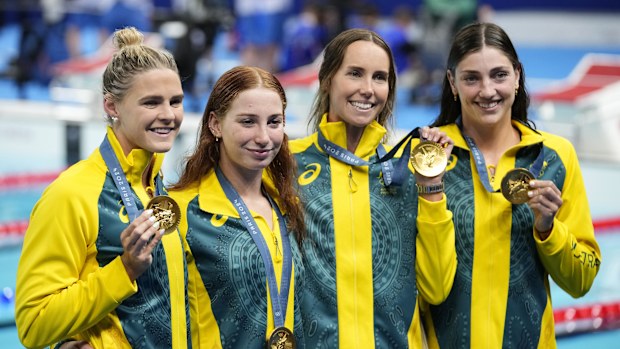 Australia's Shayna Jack, Mollie O'Callaghan, Emma Mckeon and Meg Harris, from left, celebrate after winning the women's 4x100-meter freestyle relay final at the 2024 Summer Olympics, Saturday, July 27, 2024, in Nanterre, France. (AP Photo/Petr David Josek)