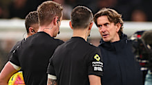 Tottenham Hotspur Manager Thomas Frank speaks to referee John Brooks during the Premier League match between Tottenham Hotspur and Liverpool.