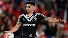 Shaun Johnson of the Kiwis kicks the ball.