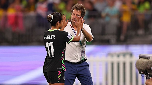 Joe Montemurro high fives Mary Fowler as she comes to the bench.