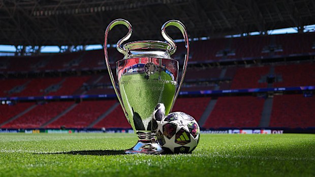 A view of the UEFA Champions League trophy with the official match ball.
