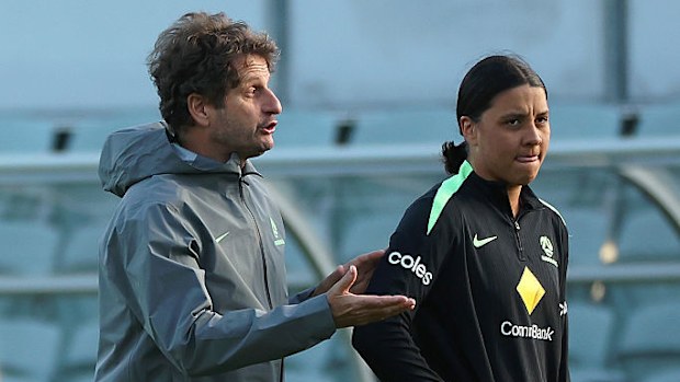 Sam Kerr looks on as Joe Montemurro of the Matildas talks.