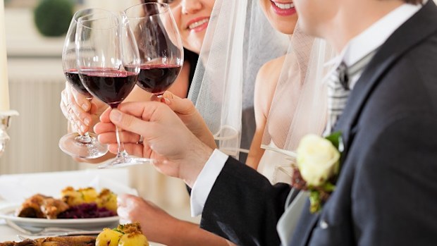 Guests at bride and groom table at wedding