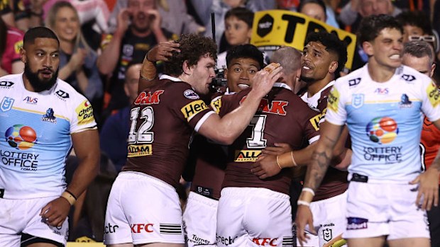 Brian To'o of the Panthers celebrates with team mates after scoring a try.
