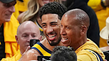 Tyrese Haliburton of the Indiana Pacers celebrates with former NBA player Reggie Miller.