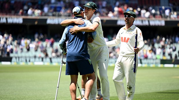 Pat Cummins embraces Nathan Lyon after securing victory in the third Test at the Adelaide Oval.