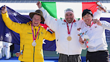 Silver medalist Ben Tudhope, of Australia, left, with gold medalist Emanuel Perathoner, of Italy, and bronze medalist Lee Jehyuk, of South Korea, pose with their medals after the men's snowboard cross SB-LL2 final.