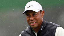 Tiger Woods of the United States looks on from the 18th green during the 2023 Masters Tournament.
